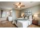 Cozy bedroom with neutral carpet, ceiling fan, and ensuite bathroom at 37677 Sable Ridge Rd, Elizabeth, CO 80107