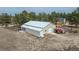 Large metal outbuilding with ample parking, a white roof, and possible shop use at 37677 Sable Ridge Rd, Elizabeth, CO 80107