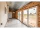 A three-season patio with lots of light entering and exit points and mixed construction materials at 37677 Sable Ridge Rd, Elizabeth, CO 80107