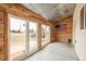A three-season patio with lots of light entering and exit points and mixed construction materials at 37677 Sable Ridge Rd, Elizabeth, CO 80107