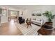 Spacious living room featuring modern furnishings, light wood floors, and lots of natural light at 1245 Troy St, Aurora, CO 80011