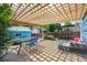 Outdoor space with a deck featuring a pergola, outdoor seating, and charming landscaping at 2645 Osceola St, Denver, CO 80212