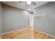 This bedroom features hardwood floors, neutral paint, and a ceiling fan at 2645 Osceola St, Denver, CO 80212