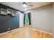 Stylish bedroom with light hardwood floors, modern wall decor, and ample natural light at 2645 Osceola St, Denver, CO 80212