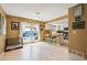 Bright dining area with white trim, barstool seating, and doors leading to the deck at 2645 Osceola St, Denver, CO 80212