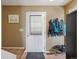 Cozy entryway with a coat rack, tile flooring, and natural light at 2645 Osceola St, Denver, CO 80212