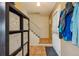 Functional entryway with a coat rack, storage cubes, and tile flooring at 2645 Osceola St, Denver, CO 80212