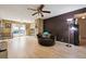Cozy living room with light hardwood floors, a ceiling fan, and an open layout at 2645 Osceola St, Denver, CO 80212