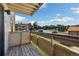 Balcony view overlooking parking and additional buildings on a bright, clear day at 420 Zang St # 3-208, Lakewood, CO 80228