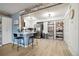 Modern kitchen with stainless steel appliances, bar seating, and open shelving at 420 Zang St # 3-208, Lakewood, CO 80228