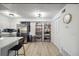 Spacious kitchen featuring stainless steel appliances, white cabinets, and open shelving at 420 Zang St # 3-208, Lakewood, CO 80228