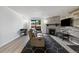 Cozy living room with stone fireplace, stylish rug, and sliding door for natural light at 420 Zang St # 3-208, Lakewood, CO 80228