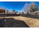 Expansive backyard with privacy fence and patio offers plenty of room for outdoor activities at 6005 E Iowa Ave, Denver, CO 80224