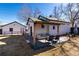 Backyard featuring open patio area with seating and a second building at 6005 E Iowa Ave, Denver, CO 80224