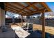 Covered patio featuring a seating area and backyard views, perfect for outdoor relaxation at 6005 E Iowa Ave, Denver, CO 80224