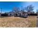 Large fenced backyard with patio, second unit and a spacious area for recreation at 6005 E Iowa Ave, Denver, CO 80224