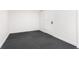 Clean basement area with neutral walls and new carpeting at 6005 E Iowa Ave, Denver, CO 80224