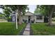 Charming single-story home with a well-maintained front yard and inviting walkway at 6005 E Iowa Ave, Denver, CO 80224