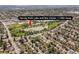 An aerial view reveals a neighborhood with parks, lakes, and recreational areas, with local amenities nearby at 1634 S King St, Denver, CO 80219