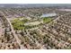 An aerial view highlights the community's layout with a mix of residences and green spaces at 1634 S King St, Denver, CO 80219
