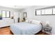 Bedroom showcasing natural light, neutral paint and decor, and hardwood floors at 1634 S King St, Denver, CO 80219