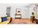 Inviting entryway featuring hardwood floors, wooden furniture, and neutral wall colors at 1634 S King St, Denver, CO 80219