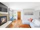 Open living room space with fireplace, natural light, and neutral decor at 1634 S King St, Denver, CO 80219