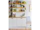 Close up view of built-in shelving with natural wood and white cabinets at 1634 S King St, Denver, CO 80219