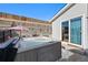 Backyard with a hot tub next to the house, featuring a privacy fence at 7745 Grant St, Denver, CO 80229