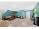 Spacious living room with fireplace, TV, and comfortable seating at 7745 Grant St, Denver, CO 80229