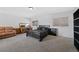 Large main bedroom features carpet, neutral paint, with a sitting area and nice natural light at 7745 Grant St, Denver, CO 80229