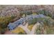 Expansive estate with lush landscaping, mature trees, and a long private driveway at 2627 E Willamette Ln, Greenwood Village, CO 80121