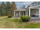Covered patio overlooking lush yard and mature trees at 2627 E Willamette Ln, Greenwood Village, CO 80121