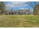 Extensive backyard with lush lawn and covered patio at 2627 E Willamette Ln, Greenwood Village, CO 80121