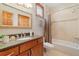Neutral bathroom features granite counters, tub and shower combo at 2627 E Willamette Ln, Greenwood Village, CO 80121