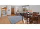 Open living space with dining area, wood floors, and large window at 2627 E Willamette Ln, Greenwood Village, CO 80121