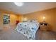 Cozy bedroom with a bed, bedside tables with lamps, and a walk-in closet for ample storage at 34 Normandy Rd, Evergreen, CO 80439