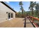 Spacious deck with French doors and seating, perfect for enjoying the mountain views at 34 Normandy Rd, Evergreen, CO 80439