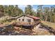 Beautiful property with an expansive deck overlooking a mature forest at 34 Normandy Rd, Evergreen, CO 80439
