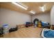 Spacious storage room with wood-paneled ceiling, laminate flooring, and ample space for organization at 34 Normandy Rd, Evergreen, CO 80439