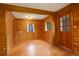 Living room featuring wood paneled walls, hardwood floors, and natural light at 184 Signal Rock Rd, Golden, CO 80403