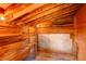 Interior view of a wooden shed featuring a workbench and open stud construction at 184 Signal Rock Rd, Golden, CO 80403