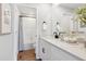 Beautiful bathroom with a quartz countertop, black hardware, and a shower and tub combination at 1415 Orchard St, Brighton, CO 80601
