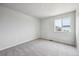 Light-filled room showcasing soft carpet and a large window allowing ample natural light at 1415 Orchard St, Brighton, CO 80601