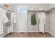 Walk-in closet featuring carpet floors, clothing rods, a small window and shelving for organized storage at 1415 Orchard St, Brighton, CO 80601