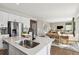 Spacious kitchen with modern appliances and a large island that opens to a bright and airy dining area at 1415 Orchard St, Brighton, CO 80601