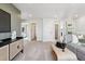 Spacious upstairs Gathering room featuring a TV area and hallways to the bedrooms at 1415 Orchard St, Brighton, CO 80601