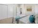 Bedroom with closet doors and a view into the living room area at 3073 S Elati St, Englewood, CO 80110
