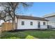 This home features a well-kept lawn, black trim, and a inviting front porch at 3073 S Elati St, Englewood, CO 80110