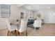 Sunlit open-concept living and dining area with modern decor and natural light at 3073 S Elati St, Englewood, CO 80110